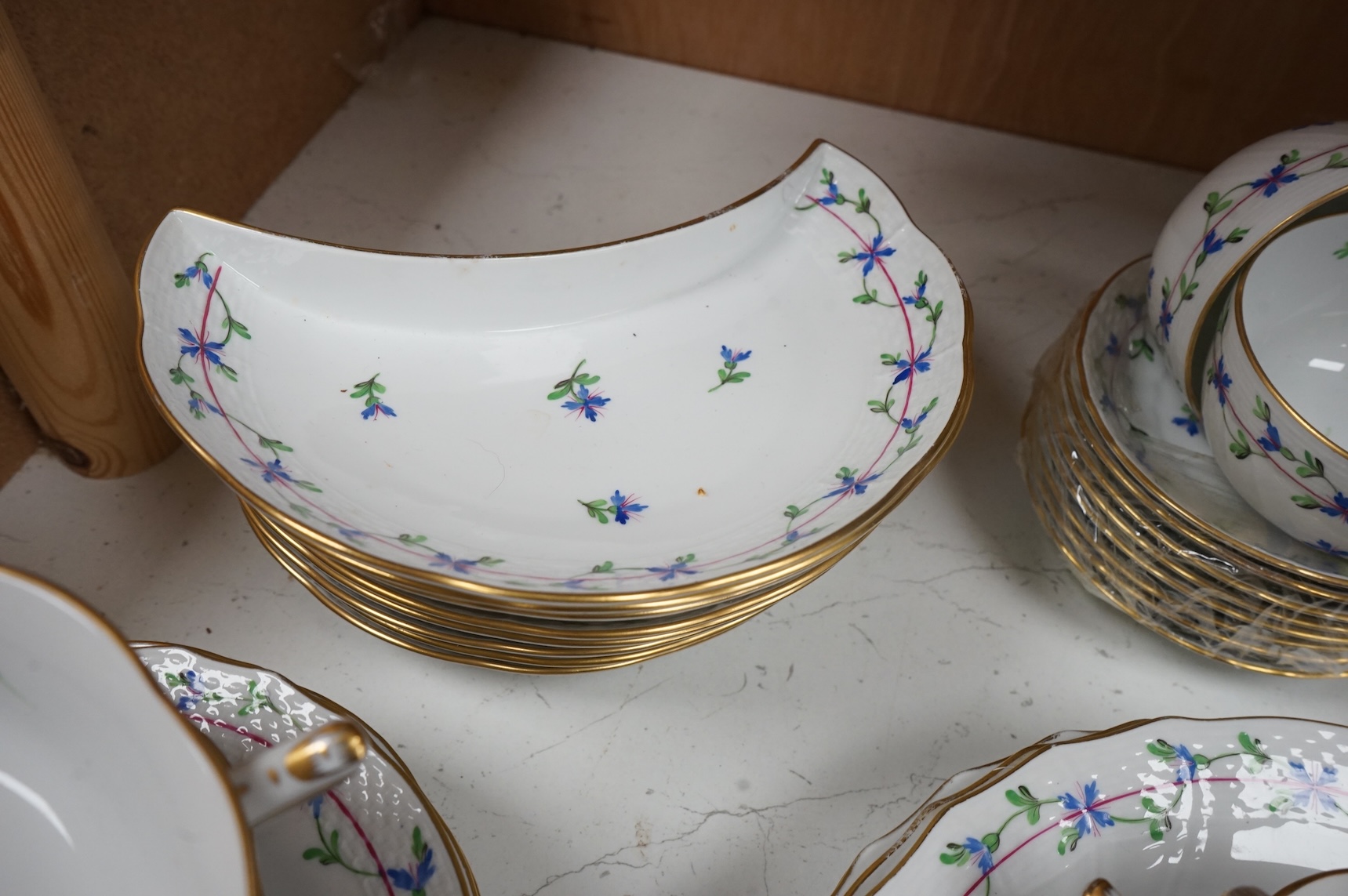 A Herend blue garland part tea set to include plates, twin handles cups and crescent dishes, largest 23cm in diameter